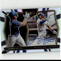A glossy, holographic baseball trading card featuring two players in action poses with blue and white uniforms.