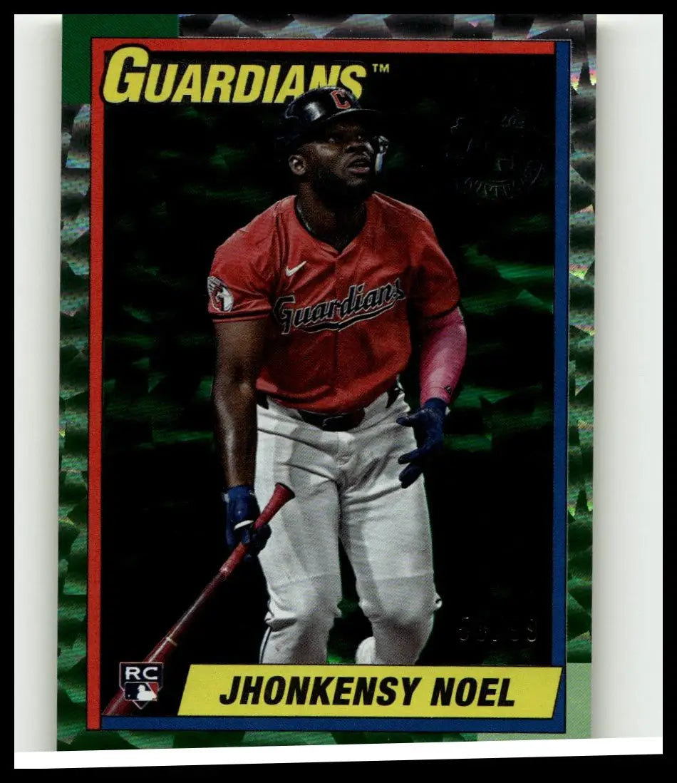 Red and white baseball jersey with guardians script worn by jhonkensy noel in green crackle foilboard batting stance
