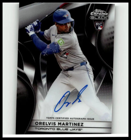 Blue helmeted baseball player orelvis martinez in gray uniform holding bat featured on 2025 topps chrome black card