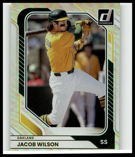 2026 donruss #13 jacob wilson optic baseball trading card showing wilson in oakland athletics yellow jersey mid-swing