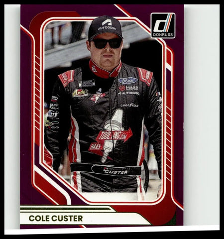 Purple and red bordered donruss trading card featuring nascar driver cole custer in black red and white suit cole custer purple