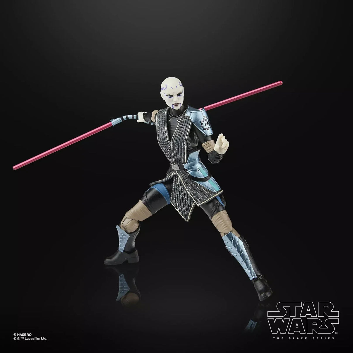 A detailed hasbro star wars the black series action figure of asajj ventress, featuring her signature white face paint and black-and-silver armored outfit with a red lightsaber.