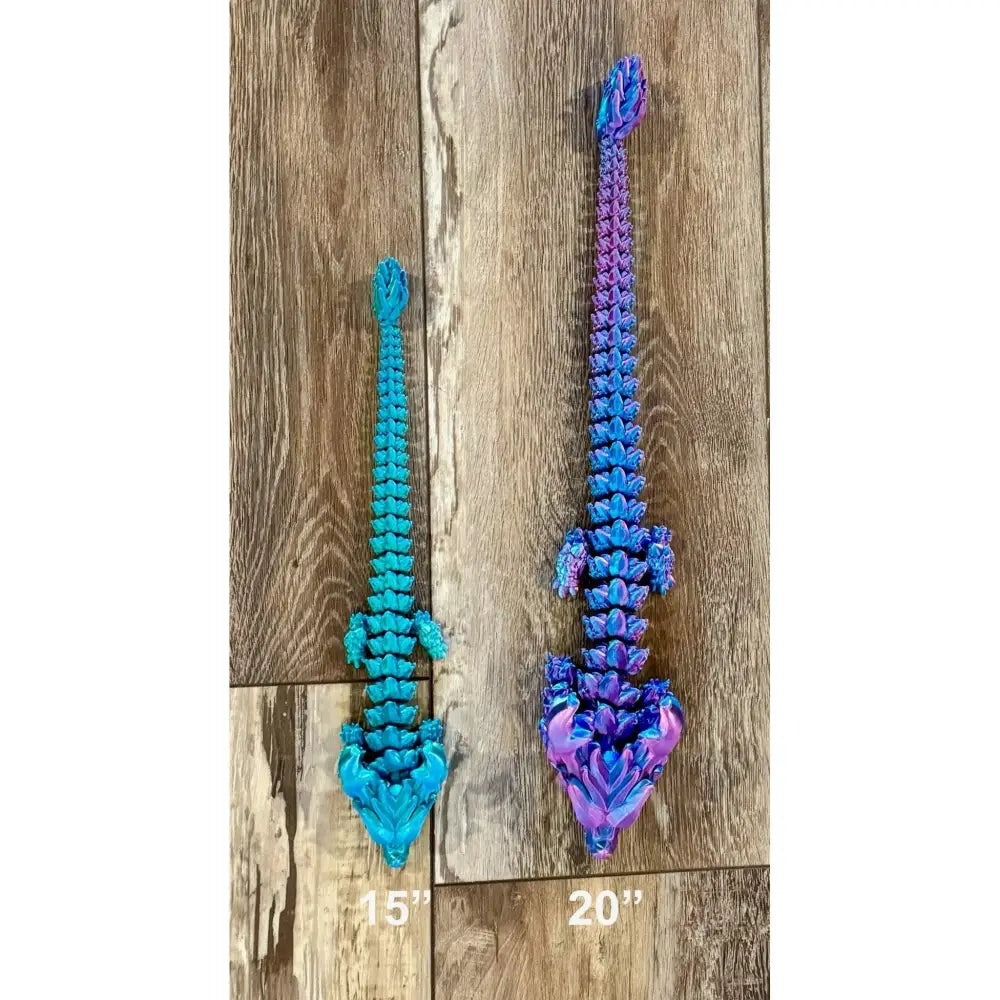 Two articulated dragon toys.