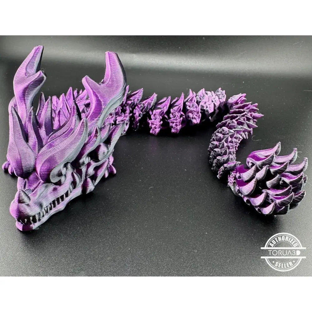Purple articulated dragon figurine.