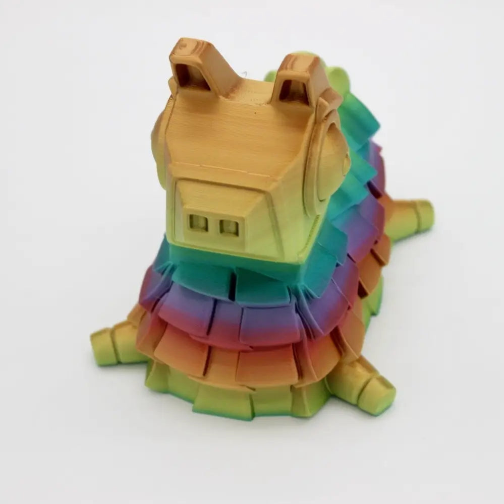 Rainbow-colored, articulated slug toy.