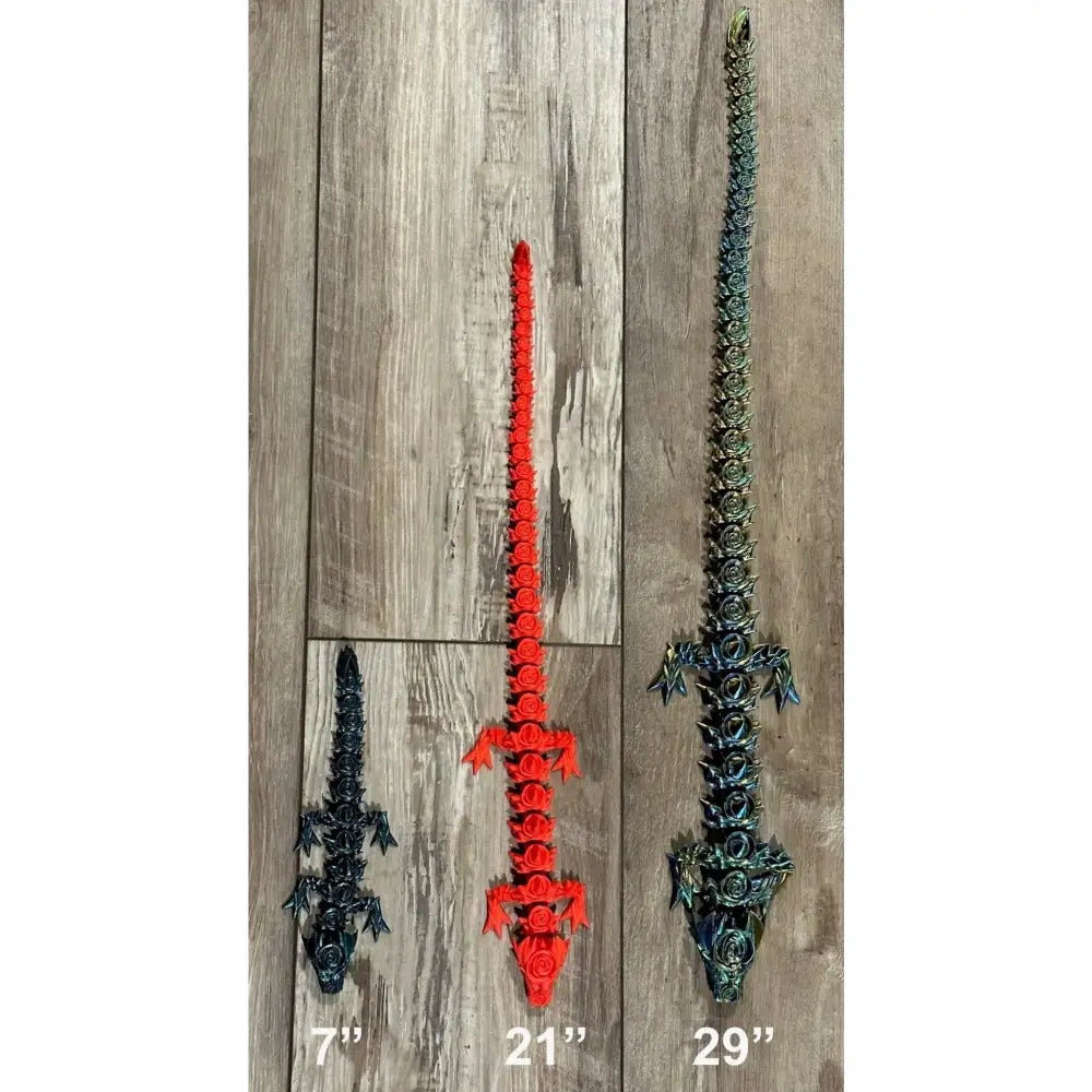 Three articulated toy alligators.