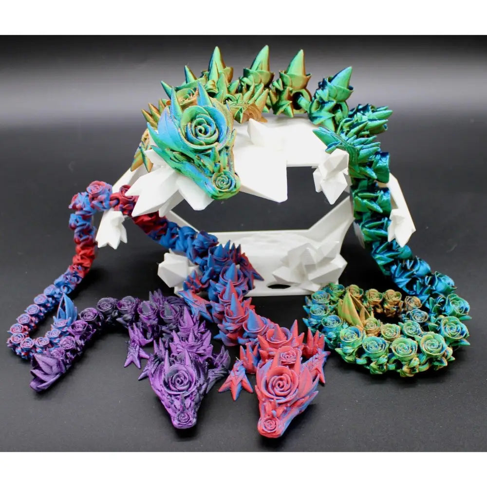 Colorful articulated rose dragon figurines.