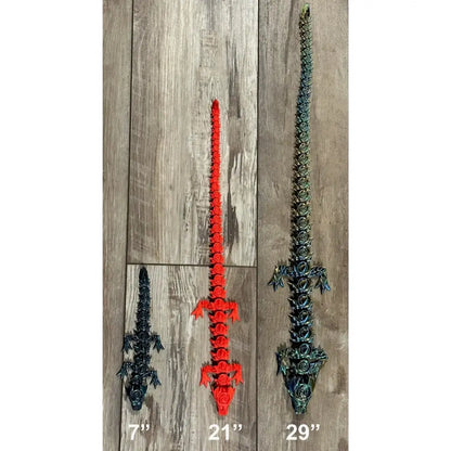 Three articulated toy alligators.