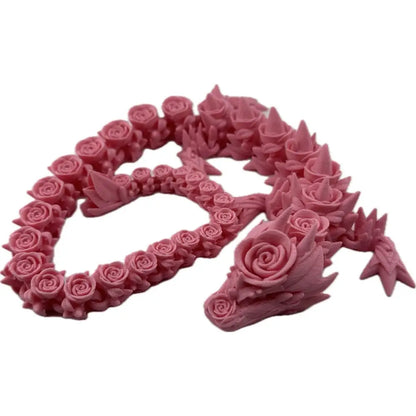 Pink rose-covered dragon figurine.