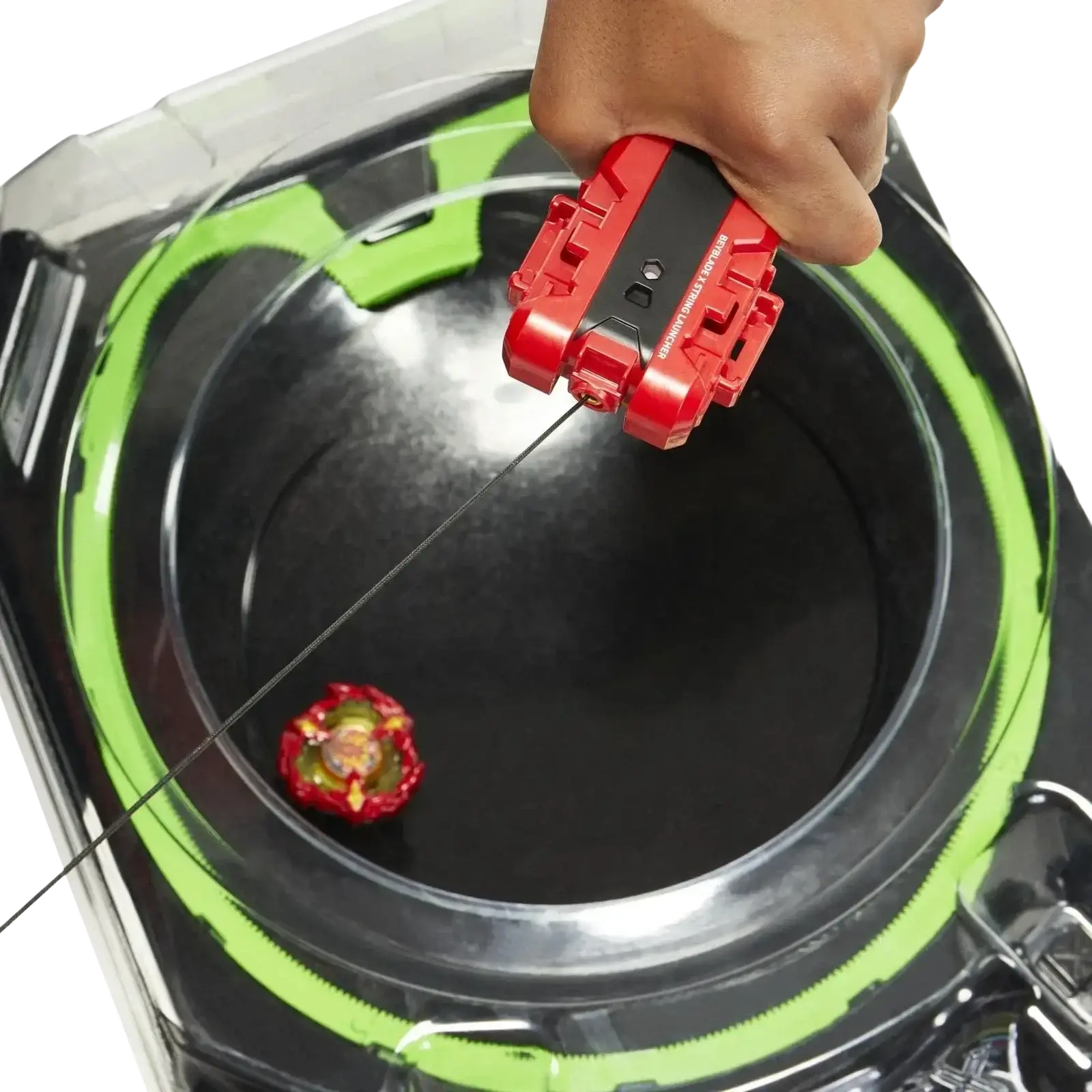 Red and black beyblade launcher with green accents being used to launch a red, yellow, and gold beyblade into the arena.