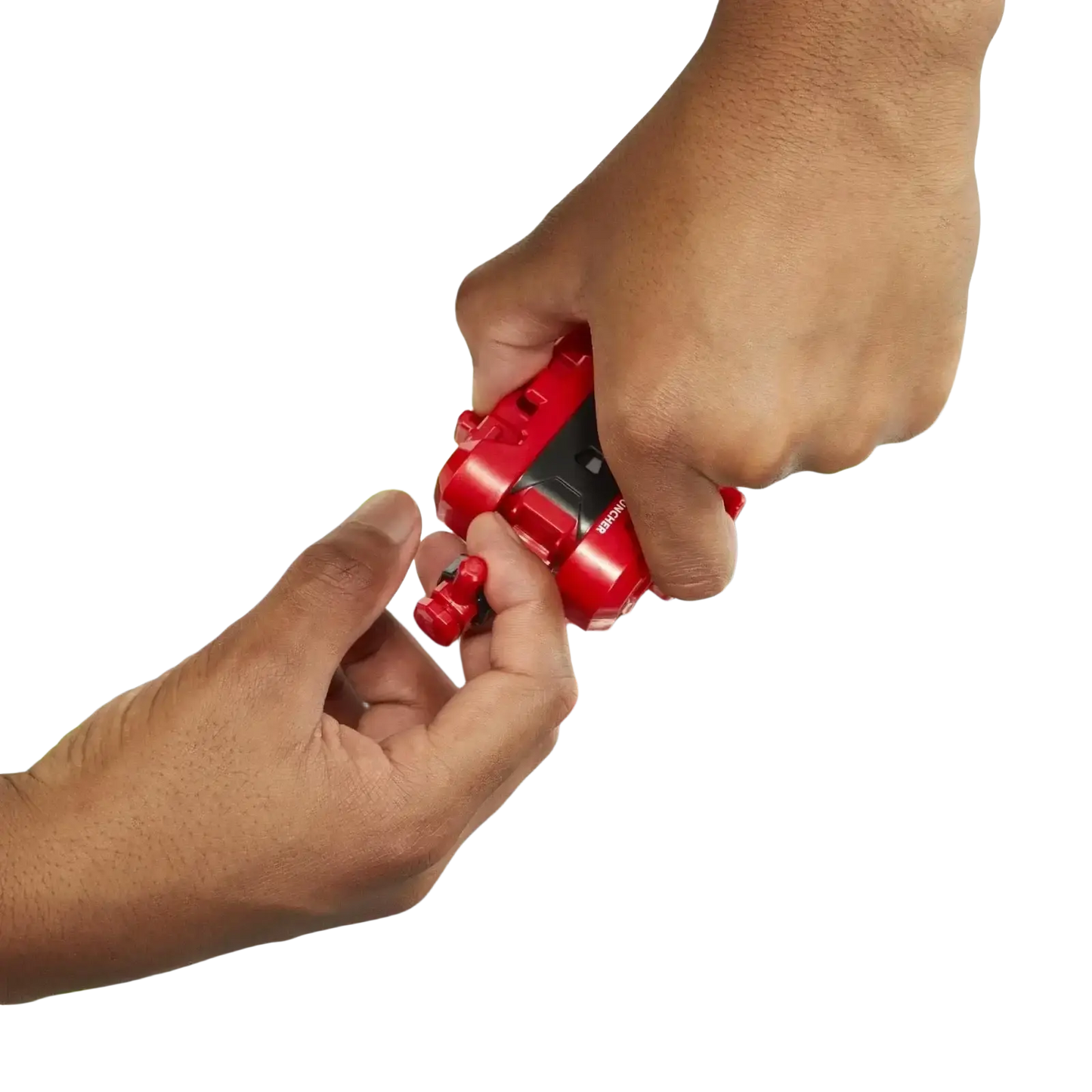 Red and black beyblade launcher being held by a hand above its arena.
