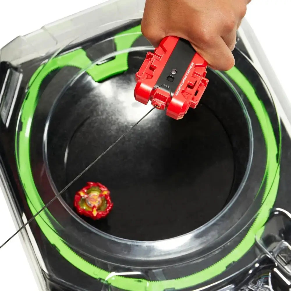 Red and black toy gun with a green ring around the base, likely from hasbro’s nerf brand.