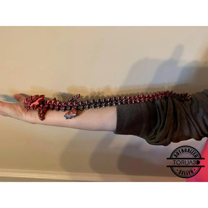 Articulated red and black dragon toy.