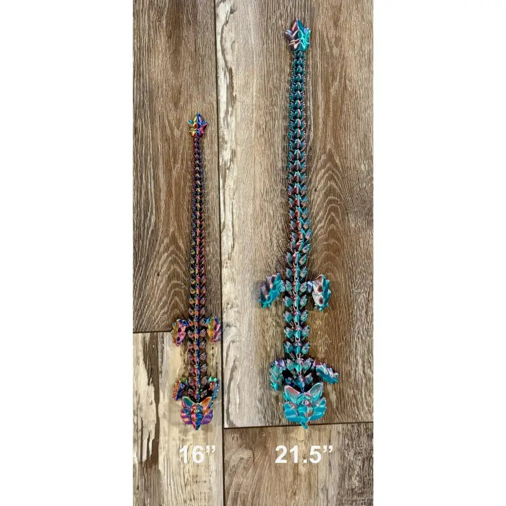 Two colorful, articulated dragon swords.