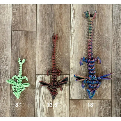 Three articulated dragon toys.