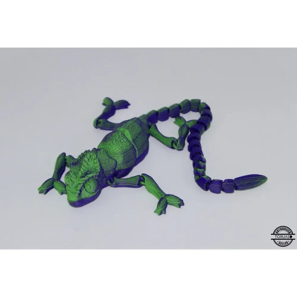 Green and purple articulated chameleon toy.