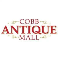 Cobb antique mall logo in red serif font with gold decorative flourishes.