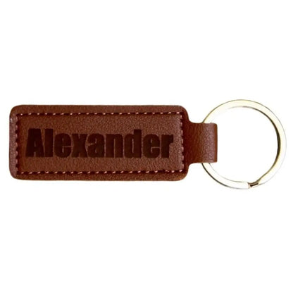 Brown leather keychain with ’Alexander’ engraved.