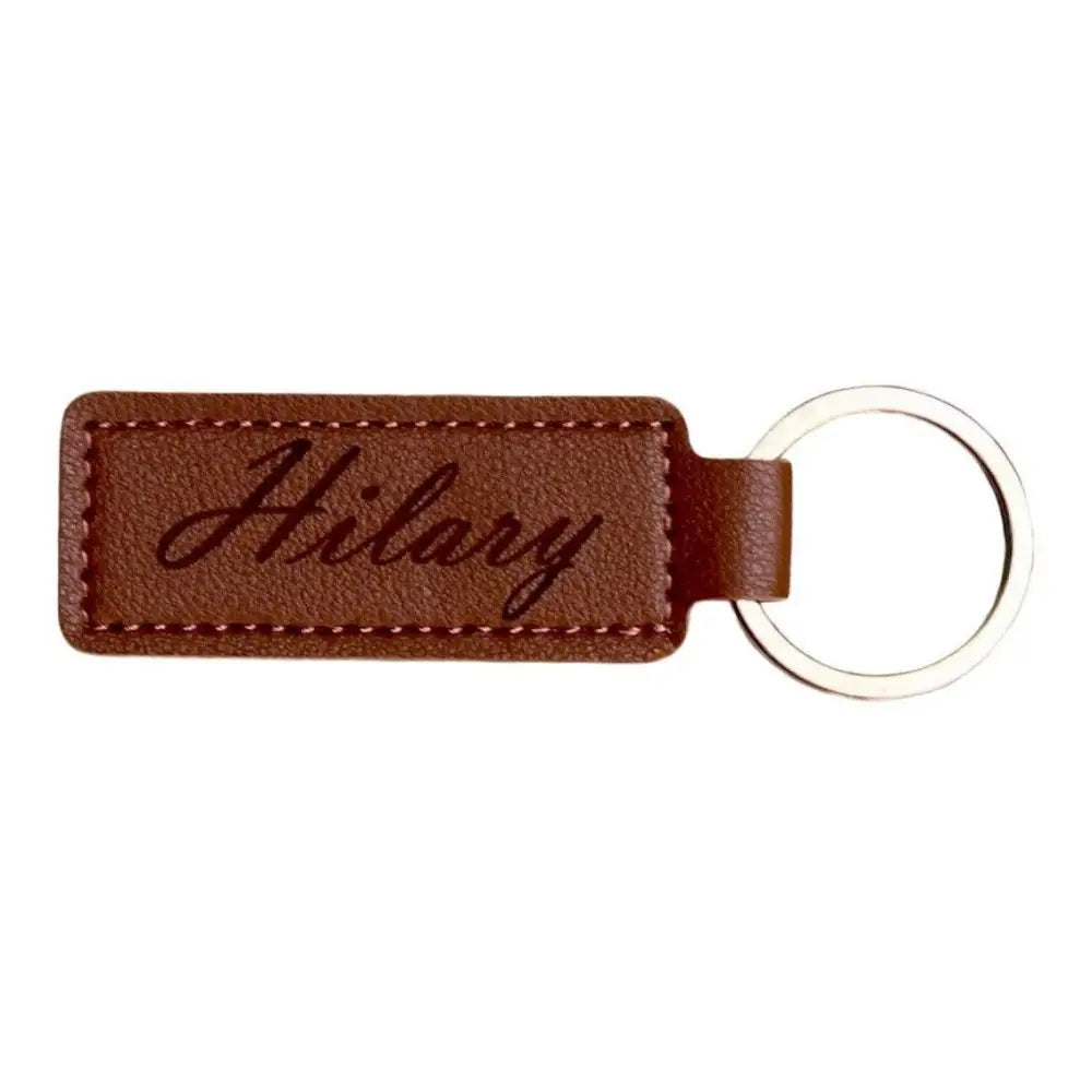 Brown leather keychain with silver ring.