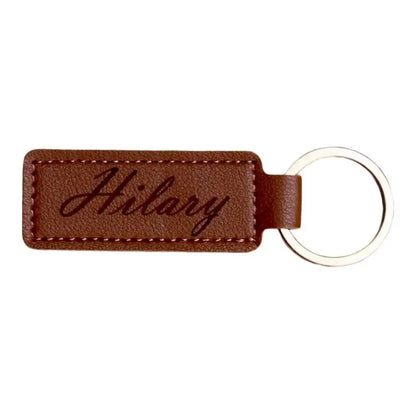 Brown leather keychain with silver ring.
