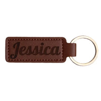 Brown leather keychain with ’Jessica’ engraved.