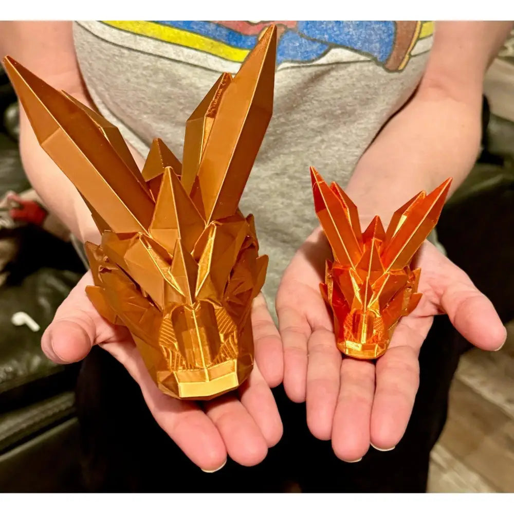 Two geometric dragon heads.