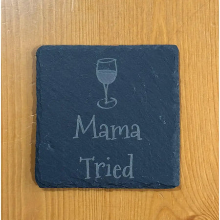 Square slate coaster with wine glass and text.