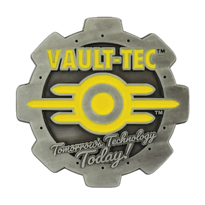 Gray metallic gear-shaped pin with vault-tec logo in yellow enamel detailing featuring fallout vault boy design