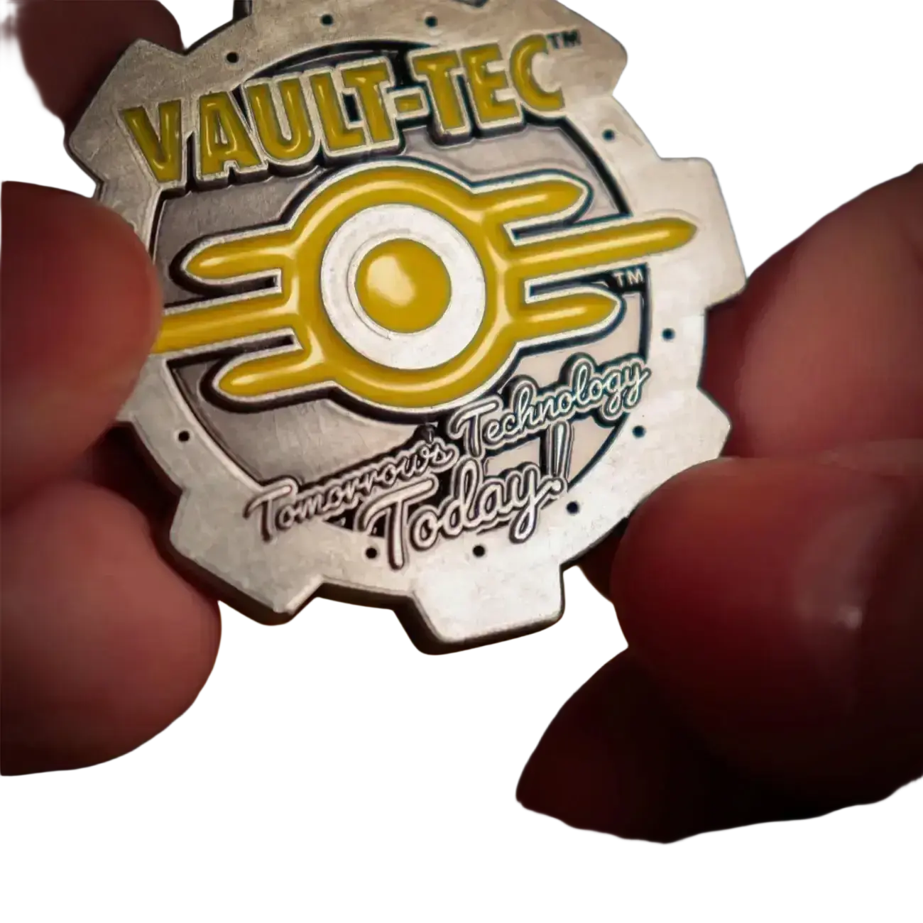 Fallout limited edition coin featuring a metallic silver and yellow vault-tec logo with enamel detailing and double-sided design