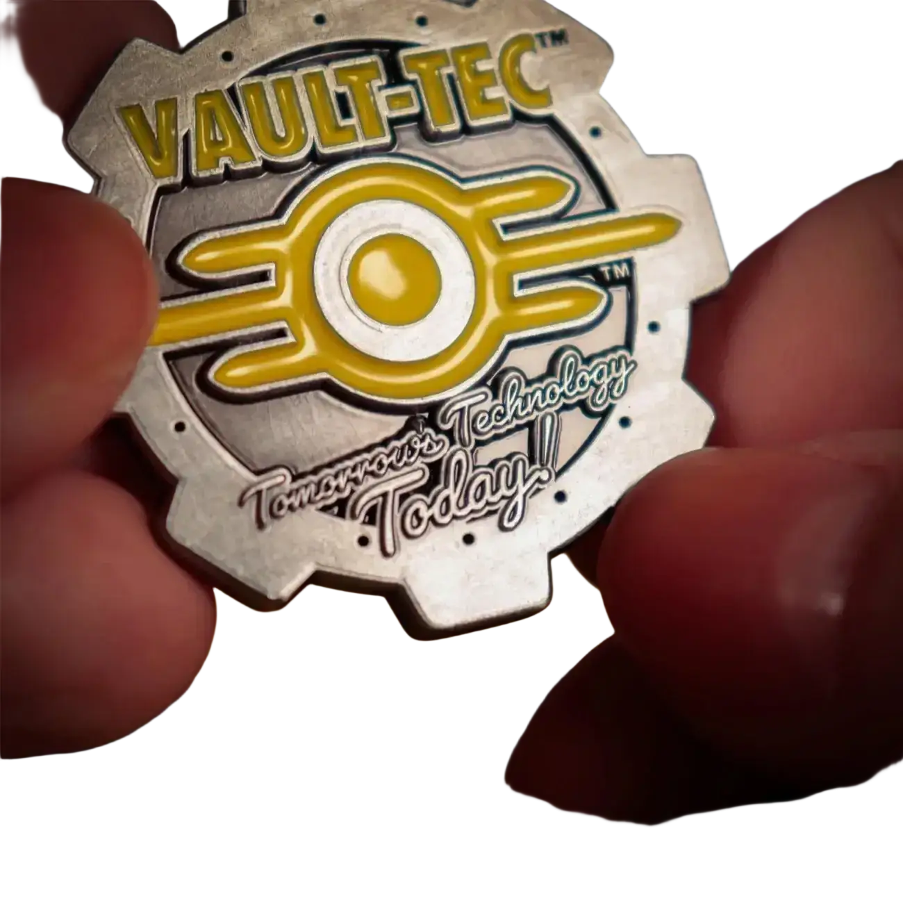 Fallout limited edition coin featuring a metallic silver and yellow vault-tec logo with enamel detailing and double-sided design