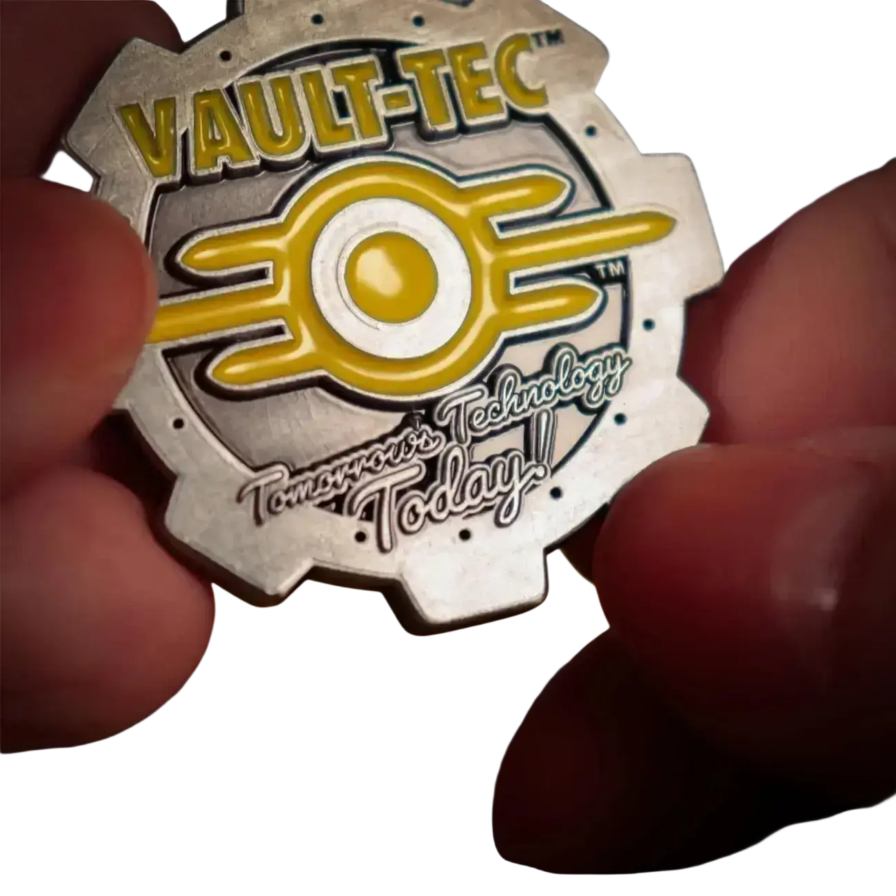 Fallout limited edition coin featuring a silver and yellow vault-tec gear design with enamel detailing and vault 111 door engraving