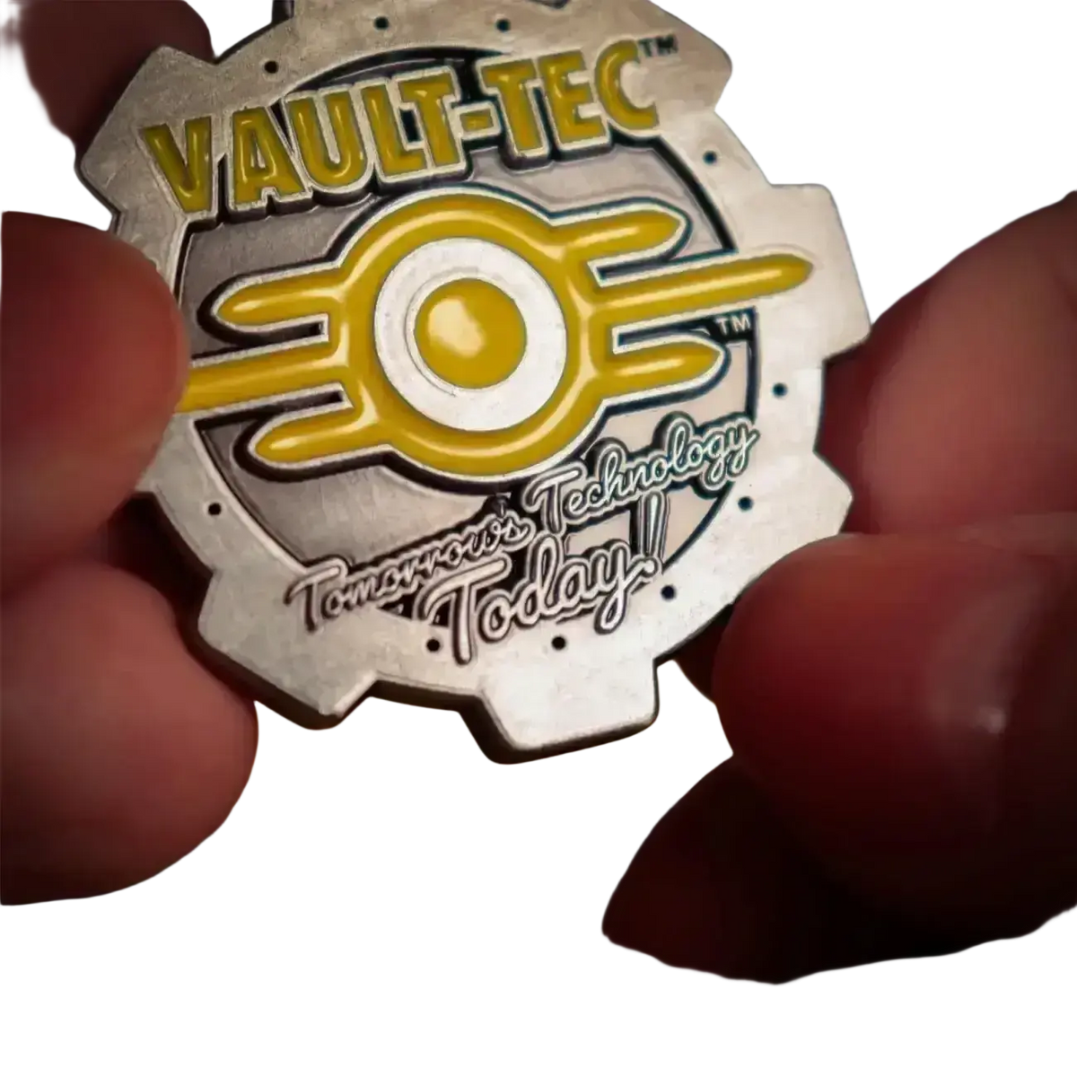 Fallout limited edition silver and yellow vault-tec gear-shaped metal medallion with enamel detailing and slogan engraving