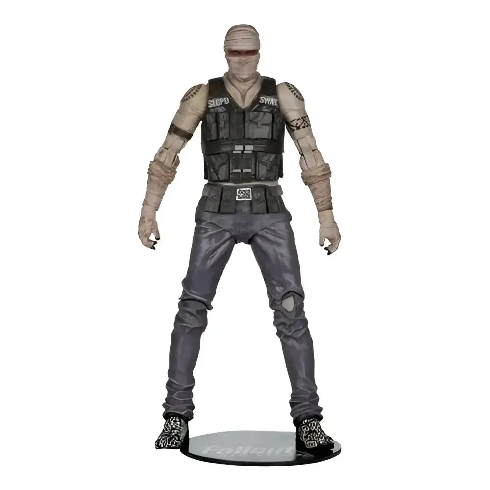 Gray and black joshua graham action figure with bandaged limbs wearing vest marked swe by mcfarlane gaming