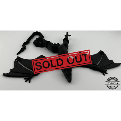 Black articulated dragon figurine.