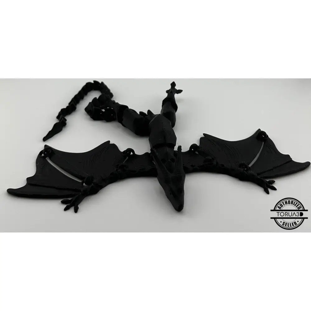 Black articulated dragon figurine.