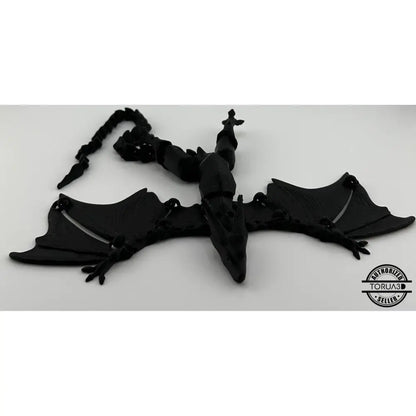 Black articulated dragon figurine.