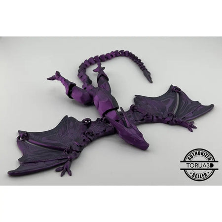 Purple articulated dragon figurine.