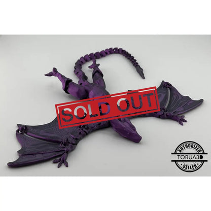 Purple articulated dragon figurine.