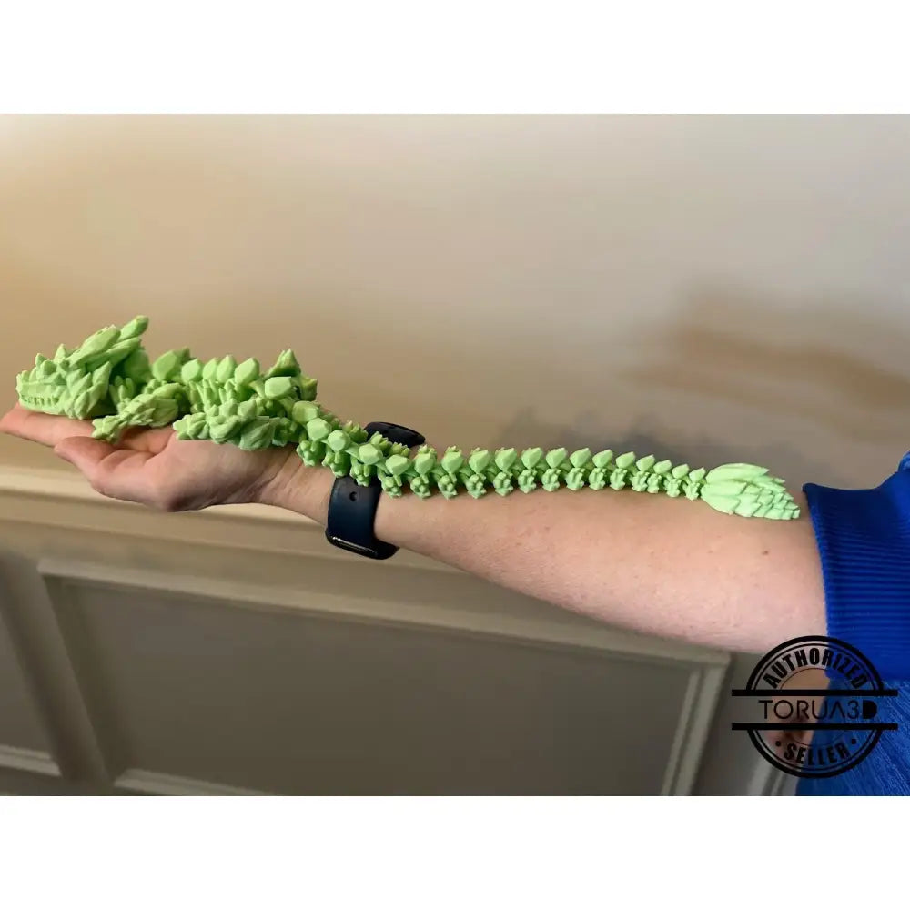 Green articulated dragon toy.