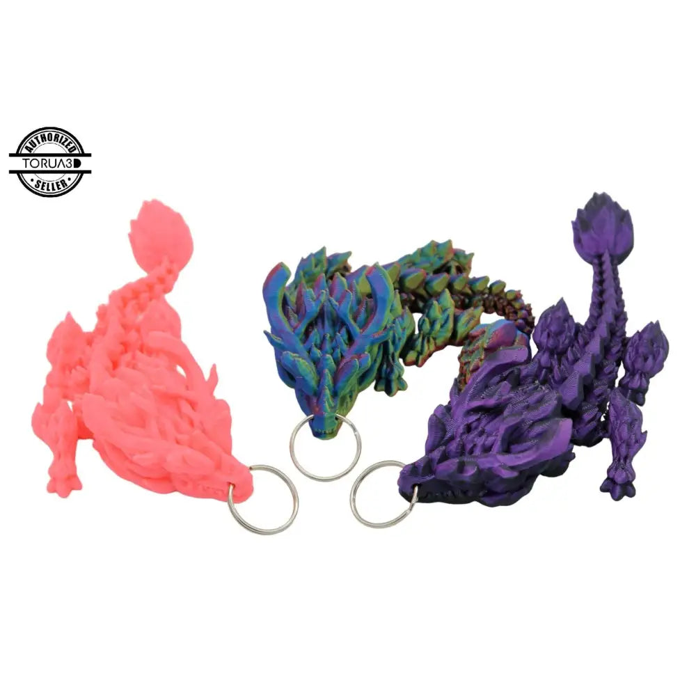 Three colorful dragon keychains.