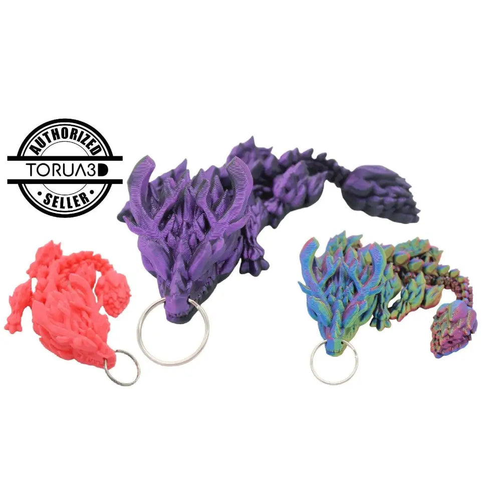 Three colorful dragon keychains.