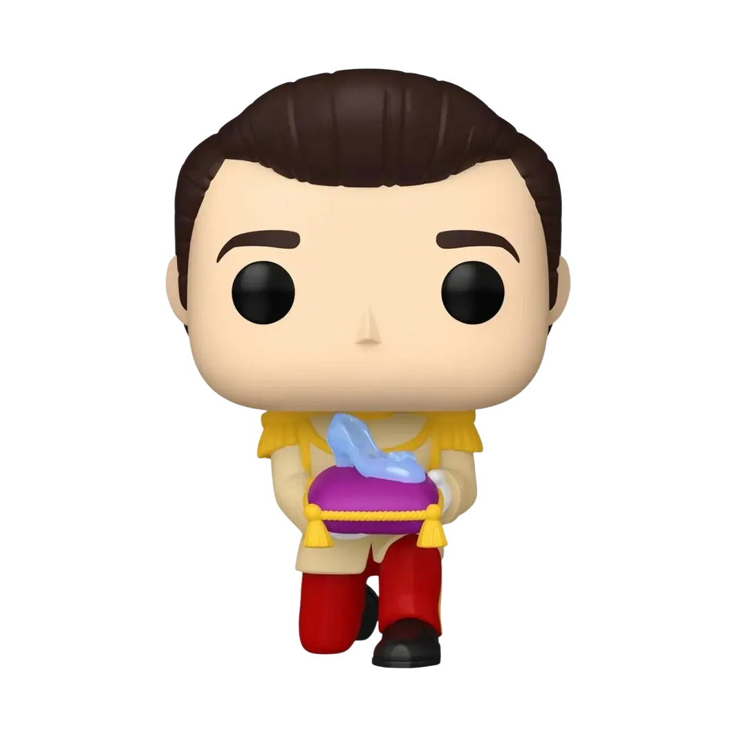 A funko pop! Vinyl figure of prince charming in a yellow and red outfit holding the glass slipper on a purple cushion.