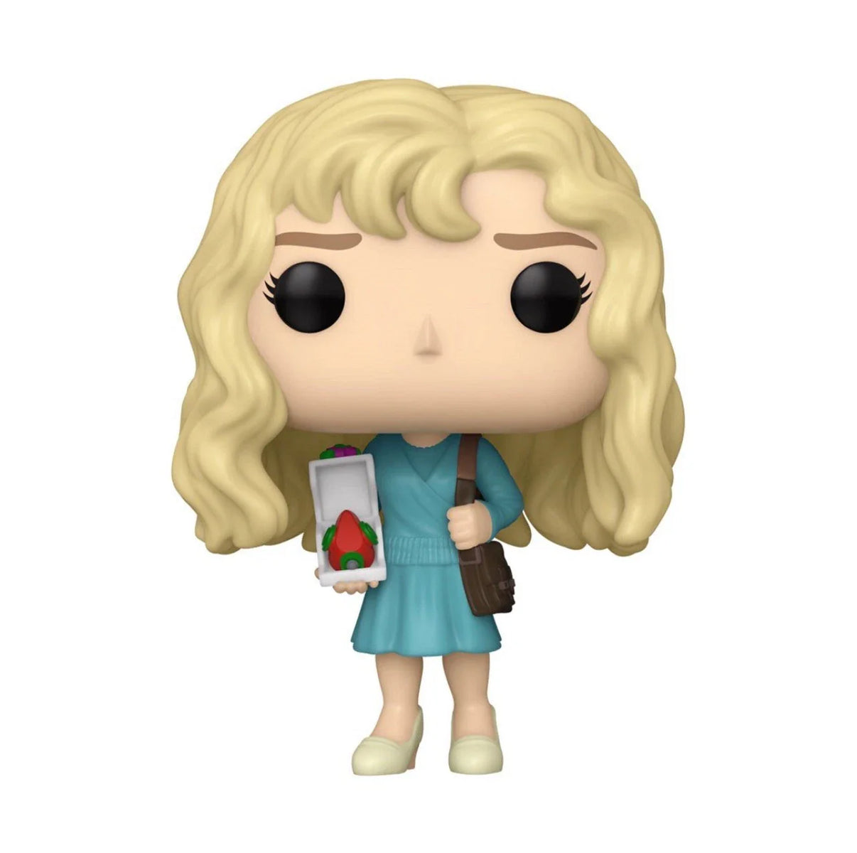 A blonde-haired funko pop! Figure dressed in a teal dress, holding an open box with a red strawberry inside and carrying a brown shoulder bag.