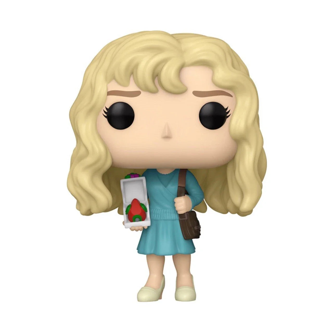 A blonde-haired funko pop! Figure dressed in a teal dress, holding an open box with a red strawberry inside and carrying a brown shoulder bag.