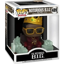 Funko pop action figure of the notorious b.i.g. Deluxe in red suit with gold crown and sunglasses seated on green stack throne
