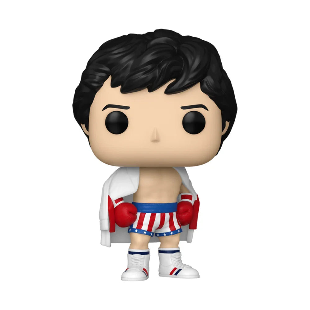 Funko pop! Vinyl figure of rocky balboa in his iconic boxing attire, featuring red, white, and blue striped shorts with stars, matching gloves, a draped white robe, and white boots.