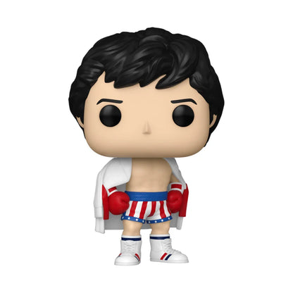 Funko pop! Vinyl figure of rocky balboa in his iconic boxing attire, featuring red, white, and blue striped shorts with stars, matching gloves, a draped white robe, and white boots.