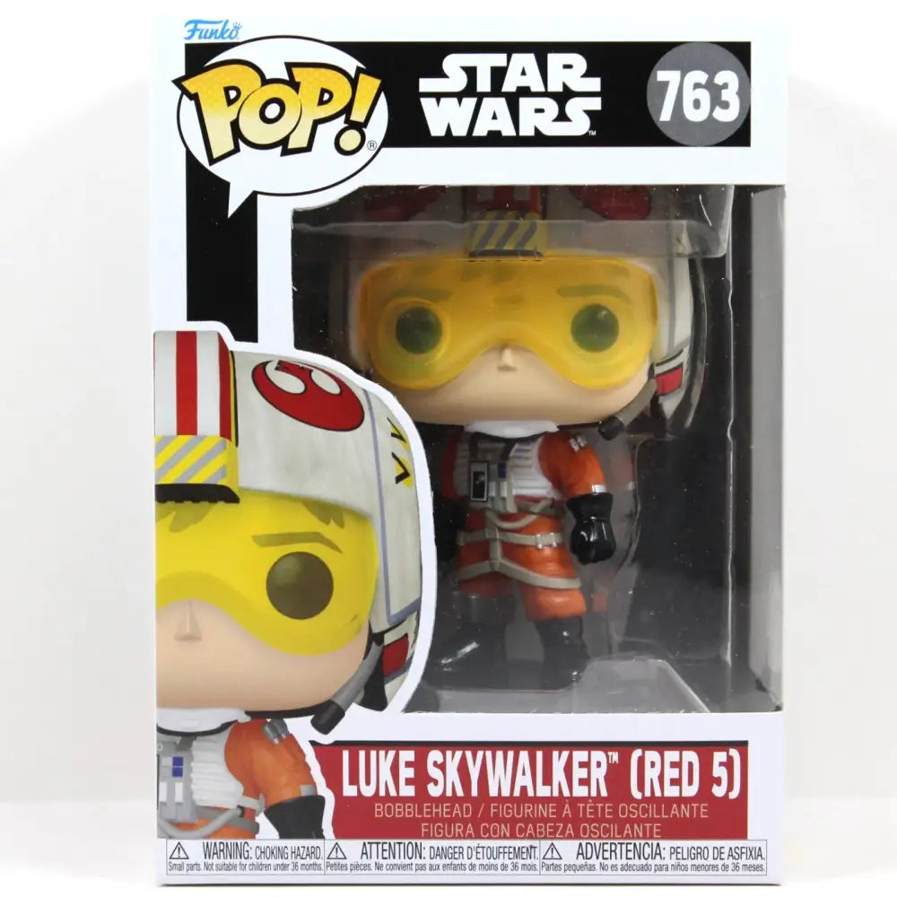 A Funko Pop! figure of Luke Skywalker (Red 5) in his pilot suit and helmet, packaged in its original box.