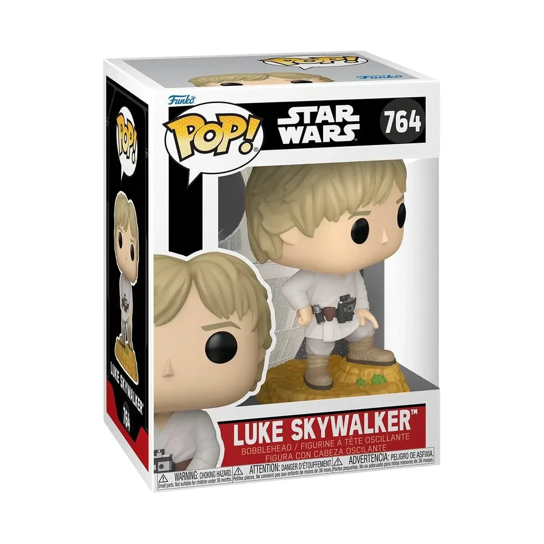 Luke skywalker funko pop! Vinyl figure in white and tan attire with black eyes, standing on a rocky base.