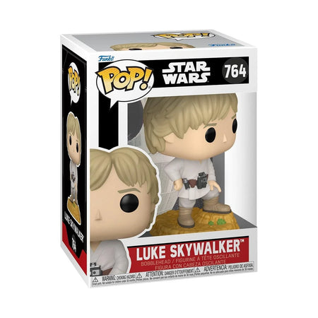 Luke skywalker funko pop! Vinyl figure in white and tan attire with black eyes, standing on a rocky base.
